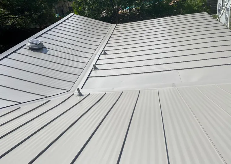 Solar attic fan installed on a metal roof for Roof Ventilation in Campbell